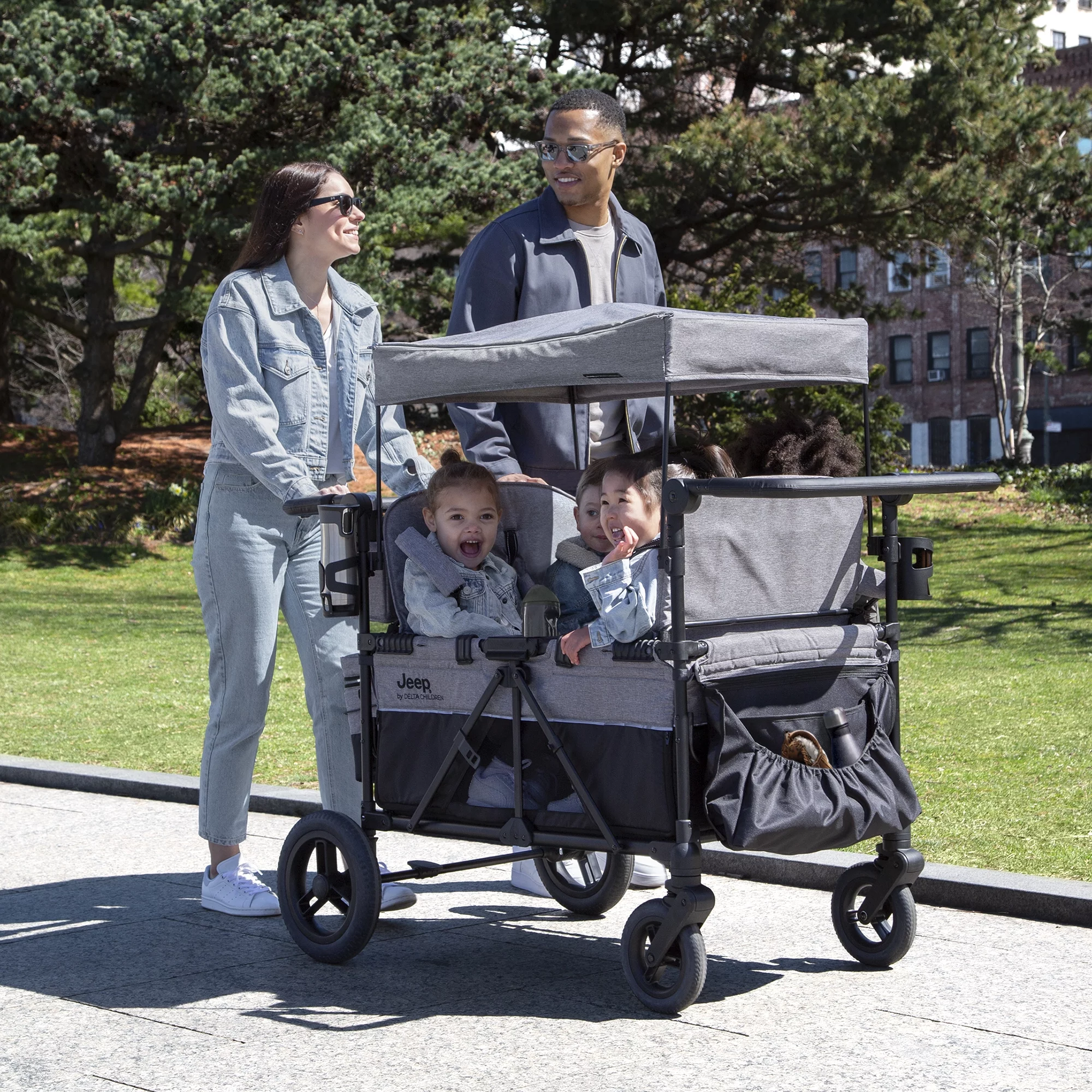 Jeep Wrangler Deluxe 4 Seater Stroller Wagon by Delta Children - Premium Quad Stroller Wagon for 4 Kids with Convertible Seats, Adjustable Push/Pull Handles, Removable Canopy & Flat Fold, Grey