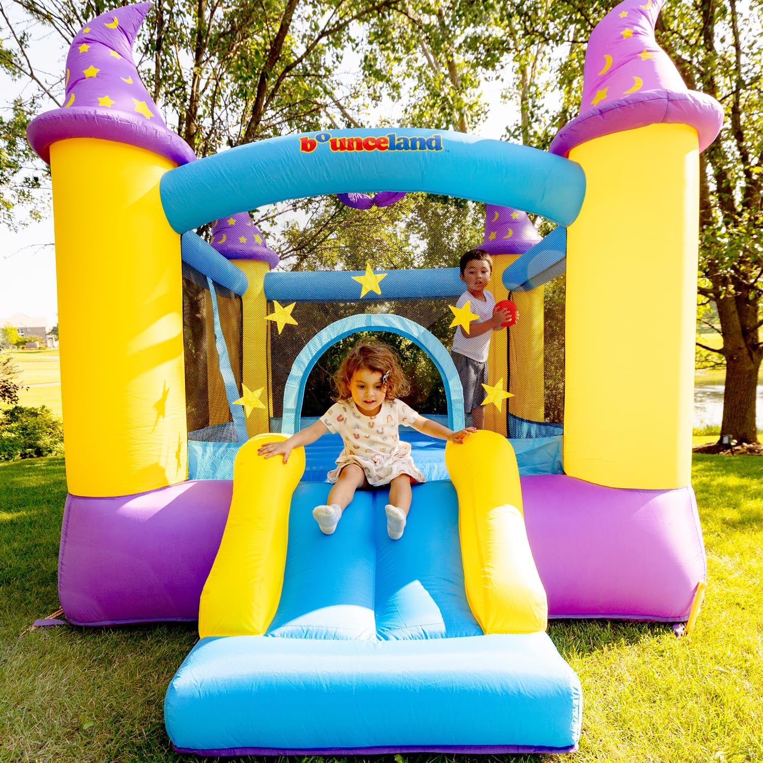 Wizard Inflatable Bounce House Bouncer, Spacious Bouncing Area with Fun Slide, Safe hook-and-loop fastener Entrance, Basketball Hoop, Fun Party Wizard Castle Theme, Inflated Size: 9 ft x 8 ft x 7 ft H