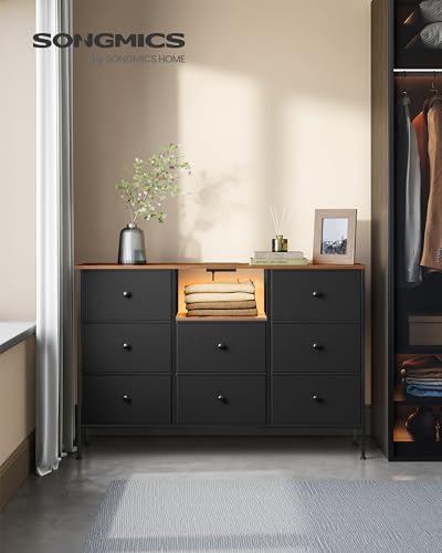 SONGMICS Chest of Drawers, Fabric Dresser with Power Outlets and LED Lights, 25 Colors, 8 Drawers, TV Stand for up to 60 Inch TVs, 11.8 x 47.2 x 31.3 Inches, Ink Black and Rustic Brown ULTS518B01